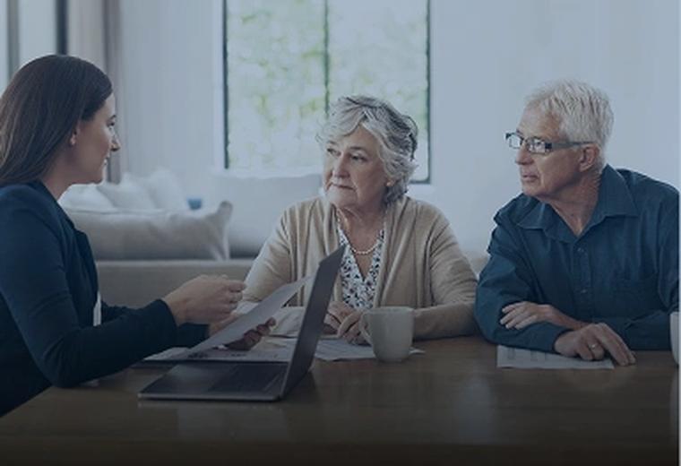 Clients reviewing documents with an attorney