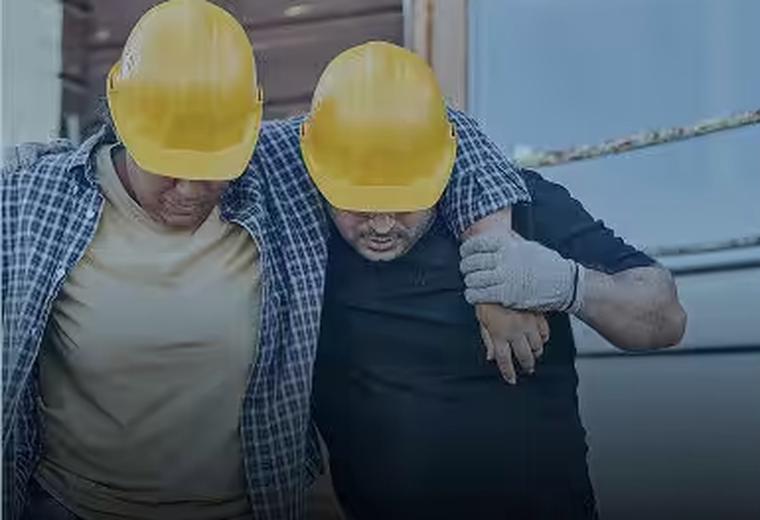 Injured worker being assisted